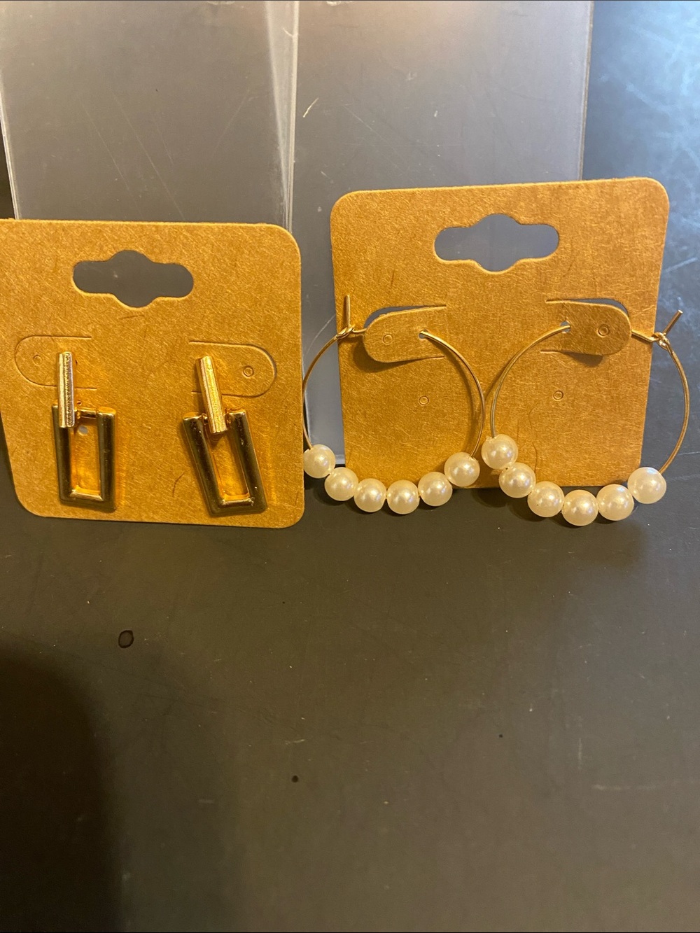 Gold Hoop Earrings with Pearl Accents and gold tone earrings.
